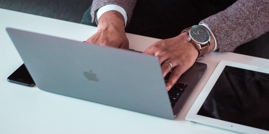Person typing on a laptop