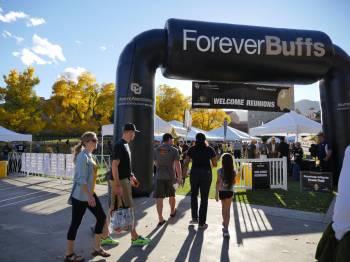 CU Boulder reunion tailgate with inflatable sign reading "Forever Buffs"